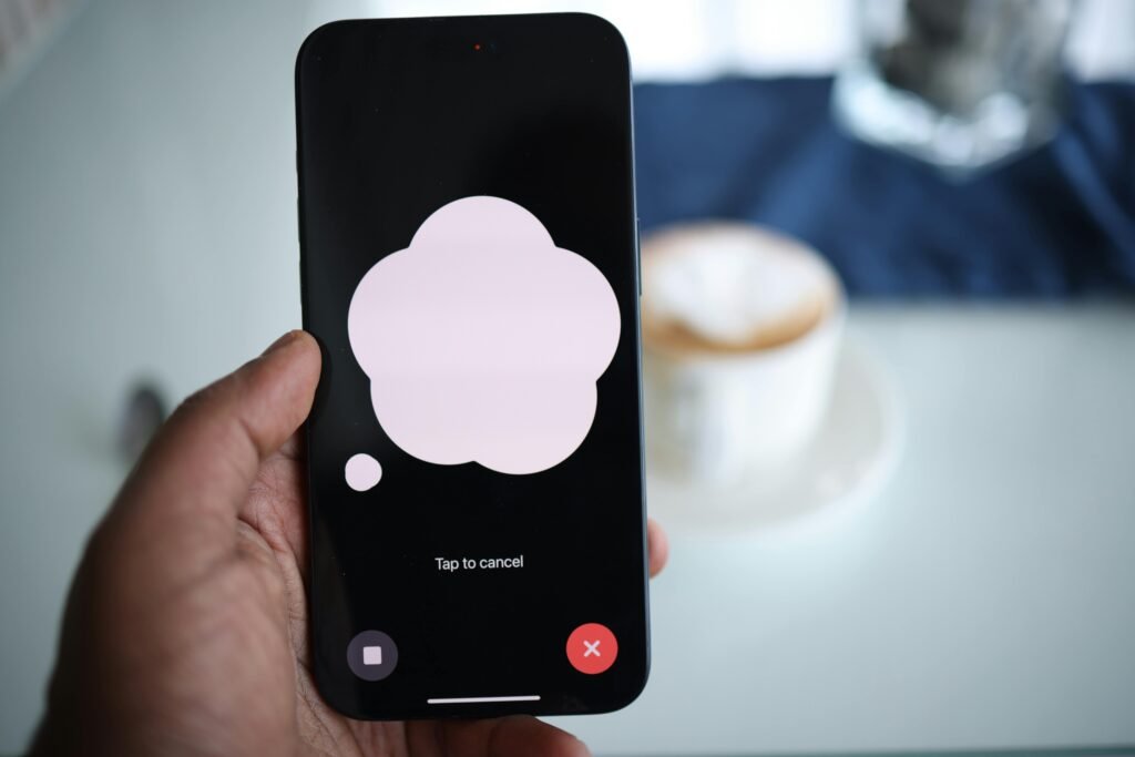 Person holding smartphone while initiating a backup setup